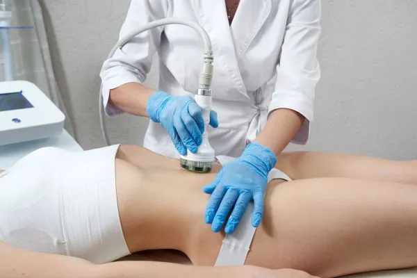Lost the Weight but Not the Loose Skin? 2 woman having HIFU treatment on her stomach to combat loose skin Telford following weight loss